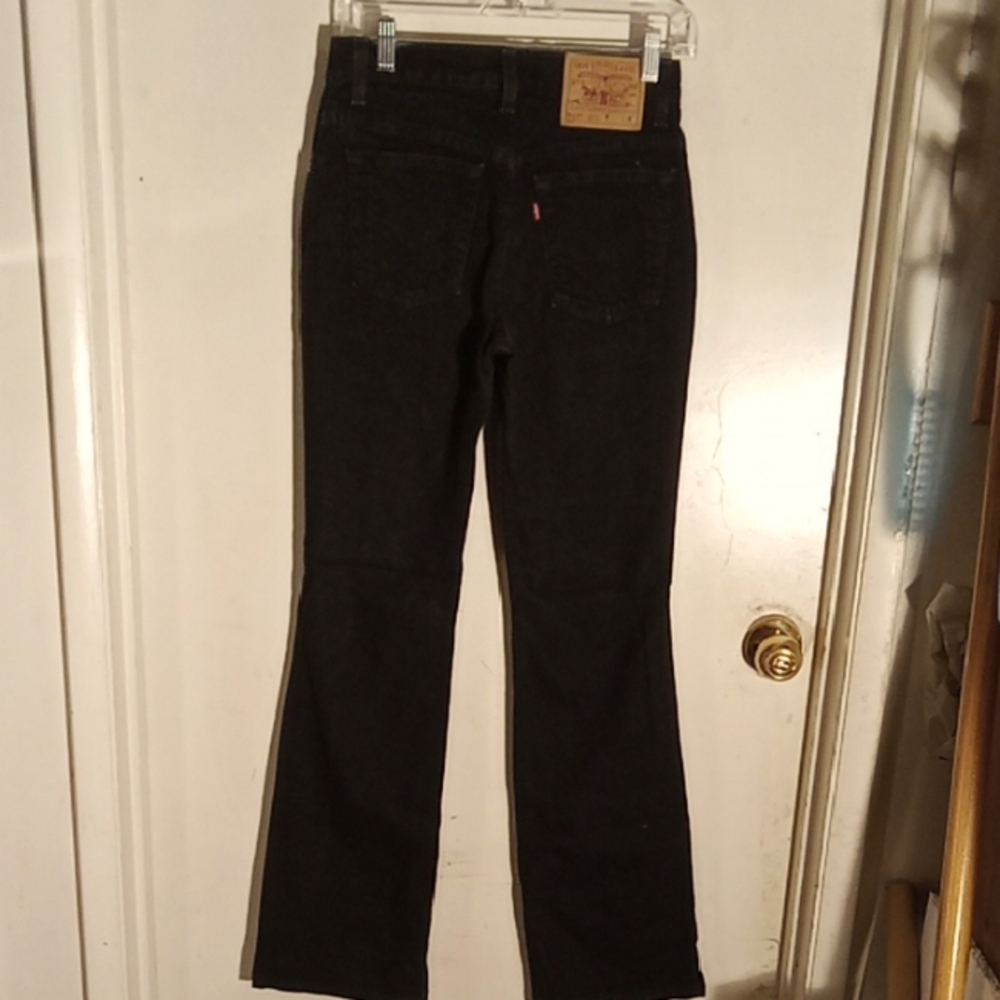 Woman's Levi jeans black some stretch. Size 3M junior slim fit boot cuts.